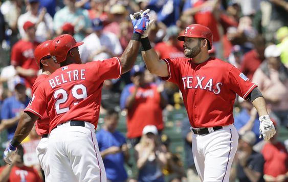 Moreland right celebrates his three run homer after scoring with Adrian Beltre and Ryan Rua during the fourth inning of a baseball game against the Pittsburgh Pirates in Arlington Texas Sunday