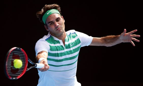 Roger Federer of Switzerland plays a forehand return to Tomas Berdych of the Czech Republic during their quarterfinal match at the Australian Open tennis championships in Melbourne Australia. (AP