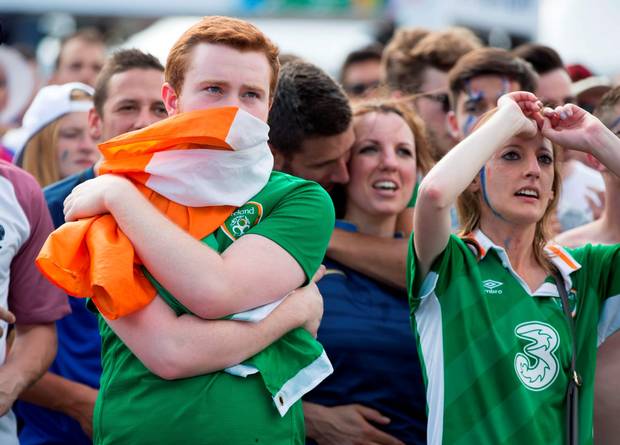 Dejected Irish fans watching Ireland and France at the fan zone in Lyon