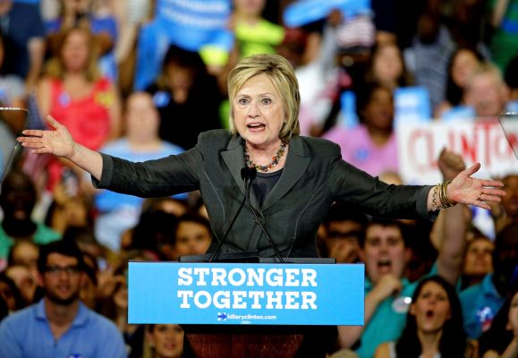 Democratic presidential candidate Hillary Clinton gestures as she