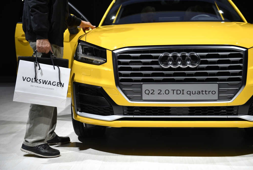 A visitor walks by an Audi Q2 quattro during the annual Volkswagen general shareholders meeting