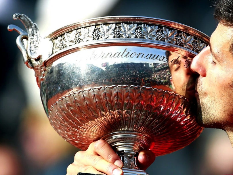 Novak Djokovic of Serbia kisses the trophy after winning against Andy Murray of Britain their men's single final match at the French Open tennis tournament./EPA