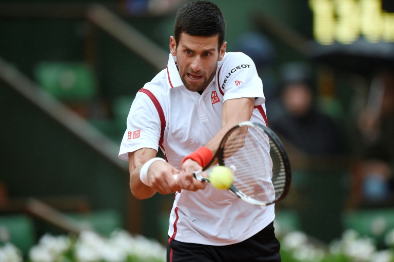 AFP  Eric FeferbergSerbia's Novak Djokovic returns the ball to Spain's Roberto Bautista Agut during their fourth round match at the Roland Garros French Open in Paris