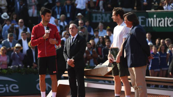 Novak Djokovic of Serbia speaks to the fans following the Men's Singles final match against