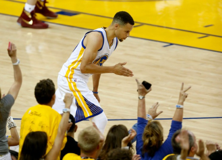 AFP  File  Beck Diefenbach Golden State Warriors guard Stephen Curry celebrates after making a basket during Game 1 of the NBA Finals against the Cleveland Cavaliers