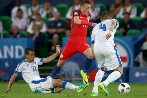 England's Jamie Vardy battles for the ball against Slovakia