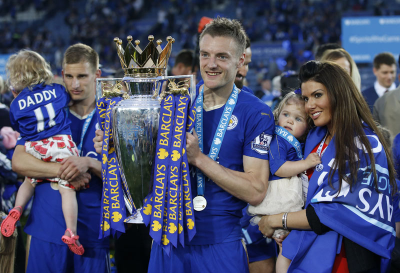 Leicester City's Jamie Vardy holds the trophy as he celebrates after beating Everton in the English Premier League match at the King Power Stadium in Leicester on Saturday