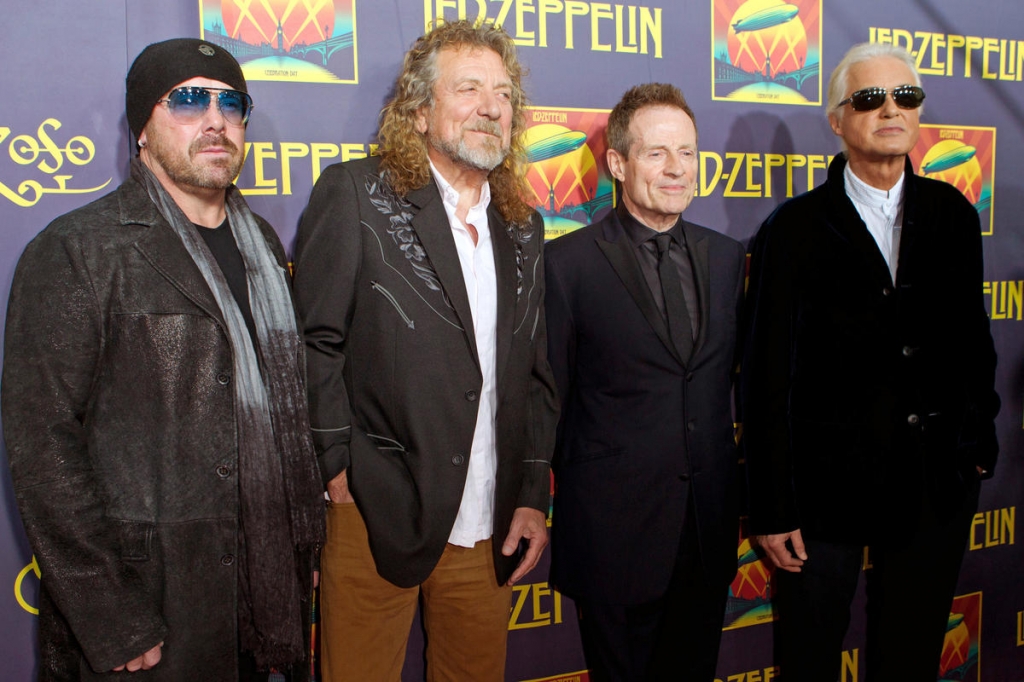 Led Zeppelin's Page dodges court questions, riffs air guitar