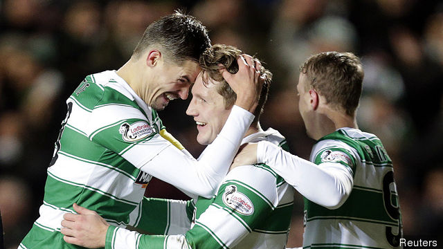 Celtic's Kris Commons celebrates scoring their fourth goal with Mikael Lustig