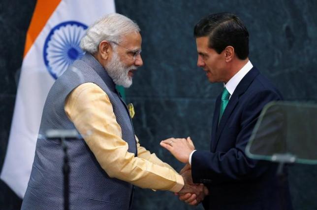 India's Prime Minister Narendra Modi shakes hands with Mexican President Enrique Pena Nieto after they gave a speech at Los Pinos presidential residence in Mexico City Mexico