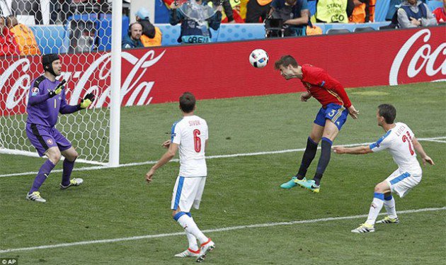 SUCKER PUNCH... Spain’s Gerard Pique leaps in the air to nod the ball past a helpless Czech Republic goalkeeper Petr Cech and seal the three points for his country in the closing stages of their match in Toulouse yesterday. — AF