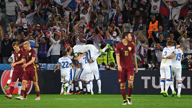 Slovakia players celebrate after scoring their second goal during the Euro 2016 Group B soccer match between Russia and Slovakia at the Pierre Mauroy stadium in Villeneuve d’Ascq near Lille France Wednesday