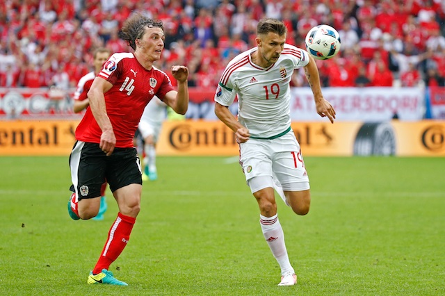 Austria's Julian Baumgartlinger in action with Hungary's Tamas Priskin. Reuters