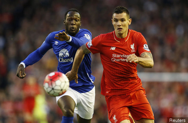 Everton's Romelu Lukaku in action with Liverpool's Dejan Lovren