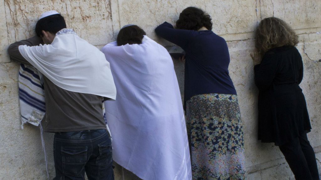 Conservative Jews pray at the temporary egalitarian Robinson's Arch prayer pavilion at the southern end of the Western Wall in Jerusalem's Old City