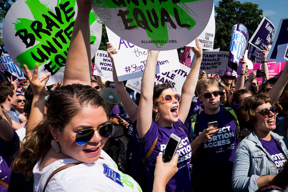 Abortion rights activists celebrate outside the U.S. Supreme Court Monday for a ruling in a case over a Texas law that places restrictions on abortion clinics