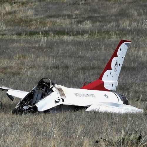 Air Force Thunderbird that crashed following a flyover rests on the ground south of the Colorado Springs Colo. airport after a performance at a commencement for Air Force Academy cadets Thursday