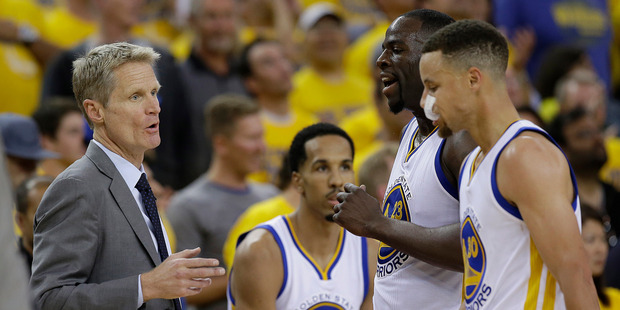 Golden State Warriors head coach Steve Kerr left talks with forward Draymond Green and guard Stephen Curry during the second half of Game 1