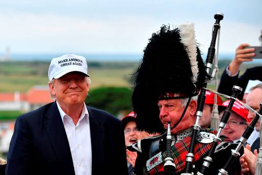 Pipe down A bagpipe player in full dress stands next to presumptive Republican nominee Donald Trump as he arrives at Trump Turnberry Resort in Scotland last week to officially reopen his golf resort