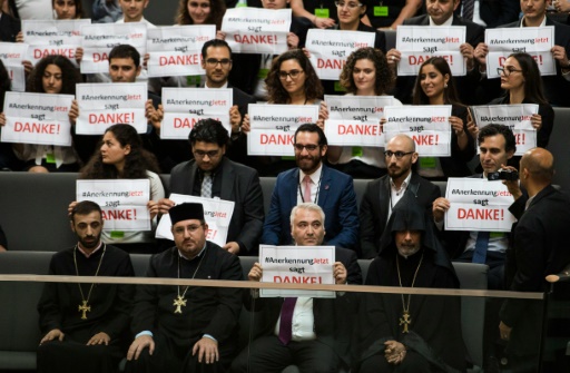 AFP  Odd Andersen. Armenian clergy members and activists hold up banners saying'thank you in the Bundestag in Berlin