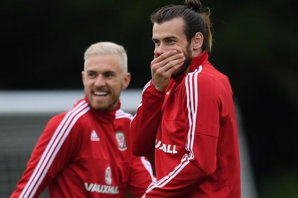 Aaron Ramsey and Gareth Bale share a joke