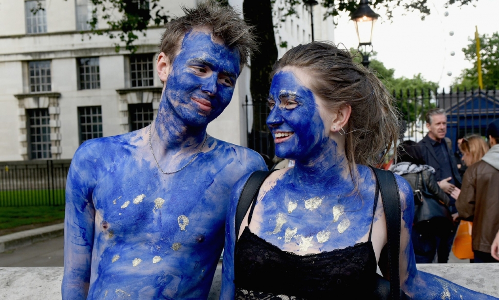 A young couple painted as EU flags protest outside Downing Street against the United Kingdom's decision to leave the EU