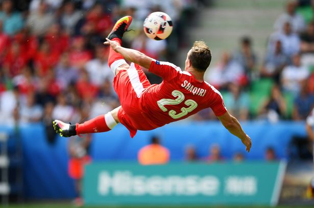 Xherdan Shaqiri of Switzerland scores his team's first goal