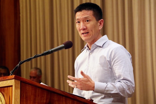 Hawaii Attorney General Doug Chin speaks during a press conference at the governor's office