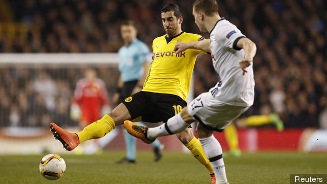 Tottenham's Kevin Wimmer in action with Borussia Dortmund's Henrikh Mkhitaryan