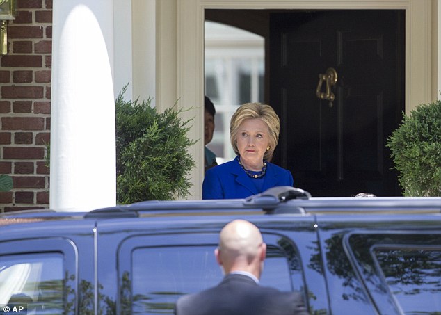 Hillary Clinton emerged from an hour-long meeting with Elizabeth Warren on Friday morning at one of her homes in Washington D.C