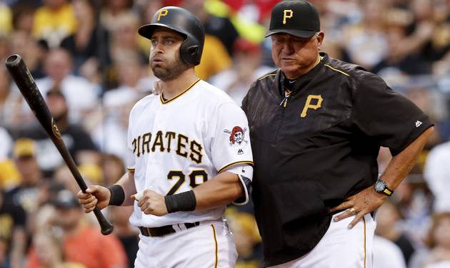 Pittsburgh Pirates&#039 Francisco Cervelli stands with manager Clint Hurdle after suffering an injury while batting against the St. Louis Cardinals during the fourth inning of a baseball game Friday