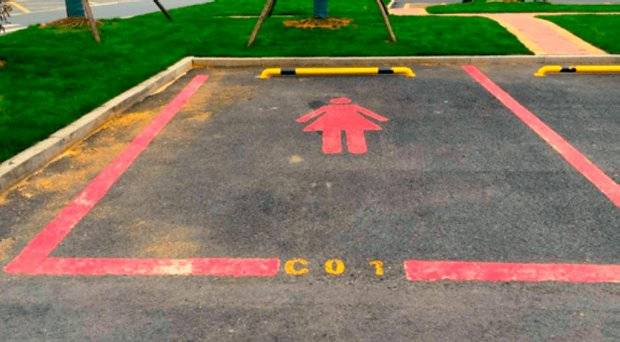 Sexism outcry over pink EXTRA WIDE parking spaces for women 'who have difficulty reversing'