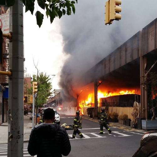 Parkin firefighters battle a blaze at the Metro North railroad tracks in New York Tuesday