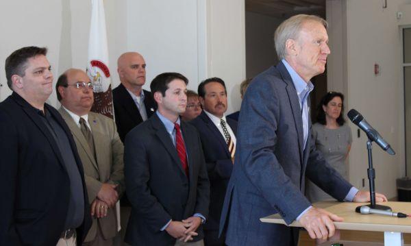 Gov. Bruce Rauner is joined by Republican Senators Chapin Rose and Jason Barickman at a stop at Middletown Prairie Elementary School in Mahomet Wednesday