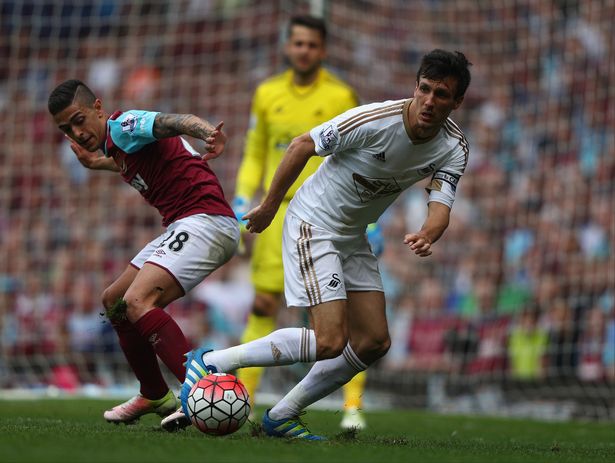 Ian Walton  Getty Images
Jack Cork of Swansea City takes on Manuel Lanzini of West Ham