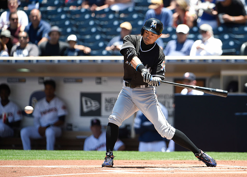 SAN DIEGO CALIFORNIA- JUNE 15 Ichiro Suzuki #51 of the Miami Marlins hits a single during the first inning of a baseball game against the San Diego Padres at PETCO Park