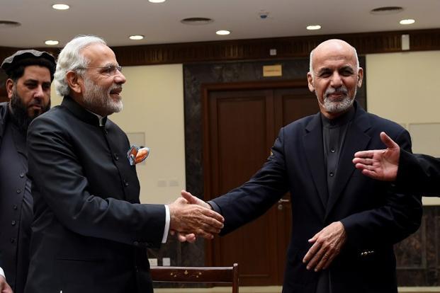 Prime Minister Narendra Modi shakes handswith Afghan president Ashraf Ghani during the inauguration of the new Parliament complex in Kabul