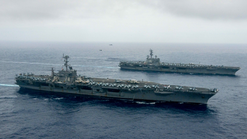 The Nimitz-class aircraft carriers USS John C. Stennis, center and USS Ronald Reagan conduct dual aircraft carrier strike group operations in the U.S. 7th Fleet area of operations in support of security and stability in the Indo-Asia-Pa