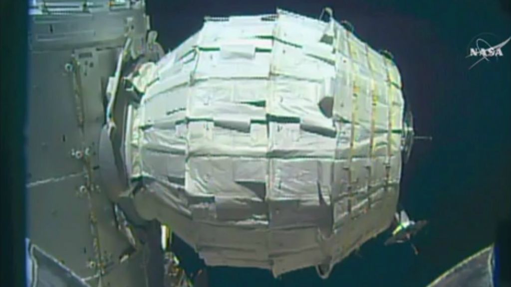 This image made from video provided by NASA shows the inflation of a new experimental room at the International Space Station on Saturday