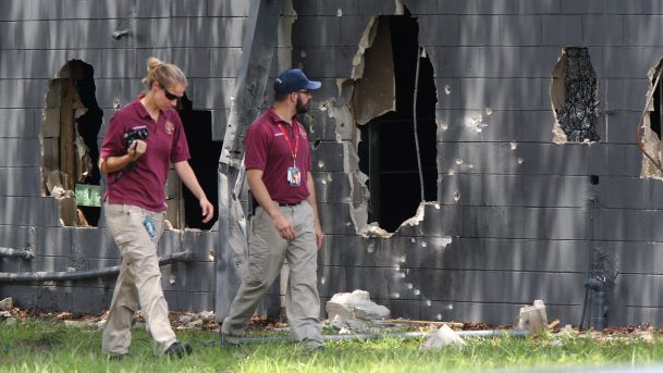 Investigators on the west side of Pulse nightclub where a gunman opened fire on Sunday morning in Orlando Florida