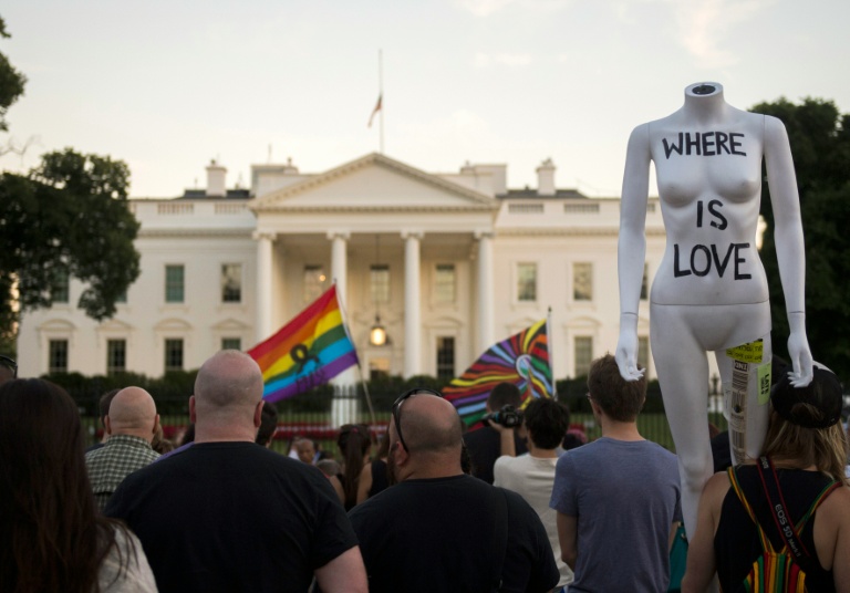 AFP  Andrew Caballero-ReynoldsMourners hold a vigil in outside the White House in Washington DC