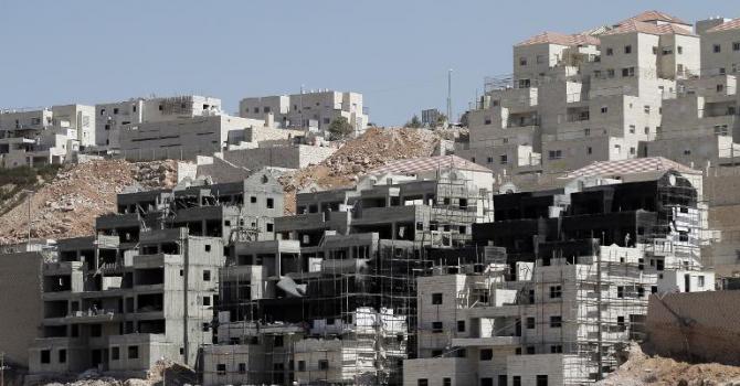 Buildings under construction are seen in the Israeli settlement of Beitar Illit near the West Bank village of Wadi Fukin