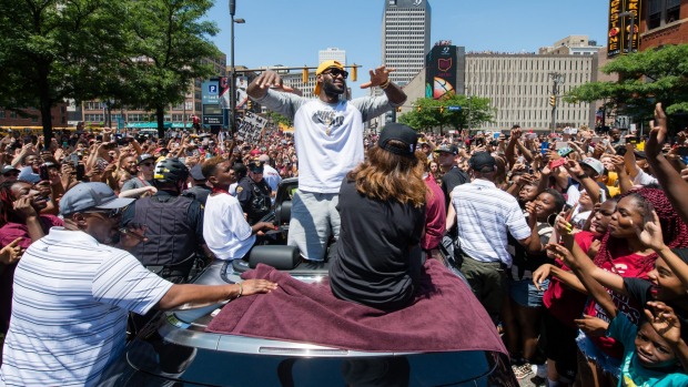 LeBron James celebrates in downtown Cleveland during the victory parade