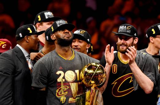 Cleveland Cavaliers forward Le Bron James celebrates with the Larry O'Brien Championship Trophy after beating the Golden State Warriors in game seven of the NBA Finals at Oracle Arena. Credit Bob Donnan-USA TODAY Sports