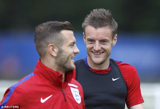 Jamie Vardy laughs with Jack Wilshere in England training- the pair could be team-mates next season