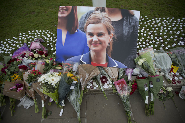 LONDON. An image and floral tributes for Jo Cox lay on Parliament Square outside the House of Parliament in London Friday