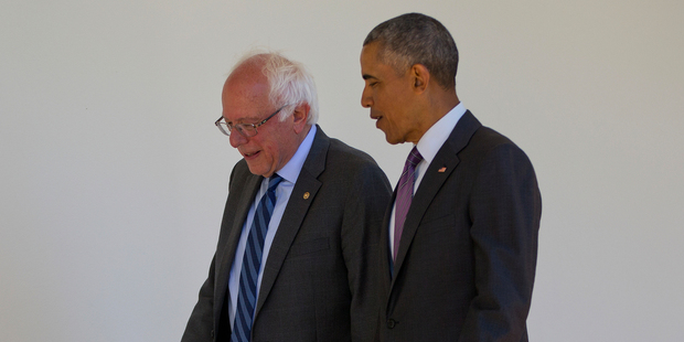 President Barack Obama walks with Democratic presidential candidate Sen. Bernie Sanders down the Colonnade of the White House in Washington