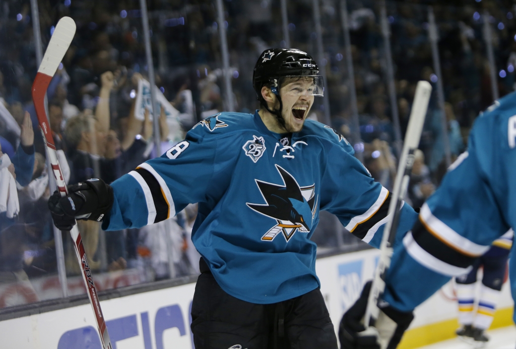 San Jose Sharks Joe Thornton celebrates with Brent Burns after Burns scored a goal against the St. Louis Blues in the second period of Game 2 of the NHL Western Conference finals at Scottrade Center in St. Louis Missouri on Tuesday