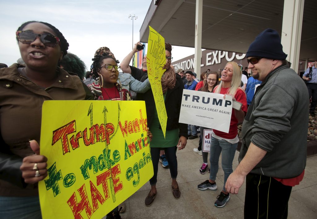 Trump supporters voice their opinions against anti Trump protesters following a campaign rally for Republican U.S. presidential candidate Donald Trump in Cleveland Ohio