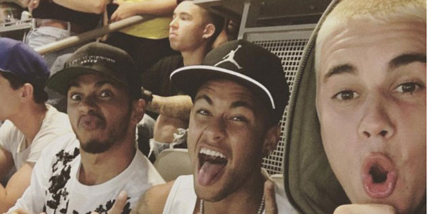 Justin Bieber took this selfie of him Neymar and Lewis Hamilton as they watched the Brazil match